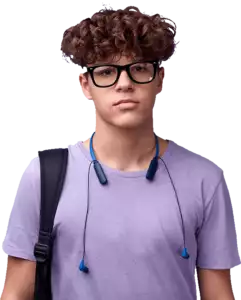Teenager in a purple shirt with headphones around his neck with a serious look on his face