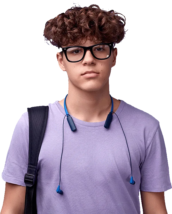 Teenager in a purple shirt with headphones around his neck with a serious look on his face